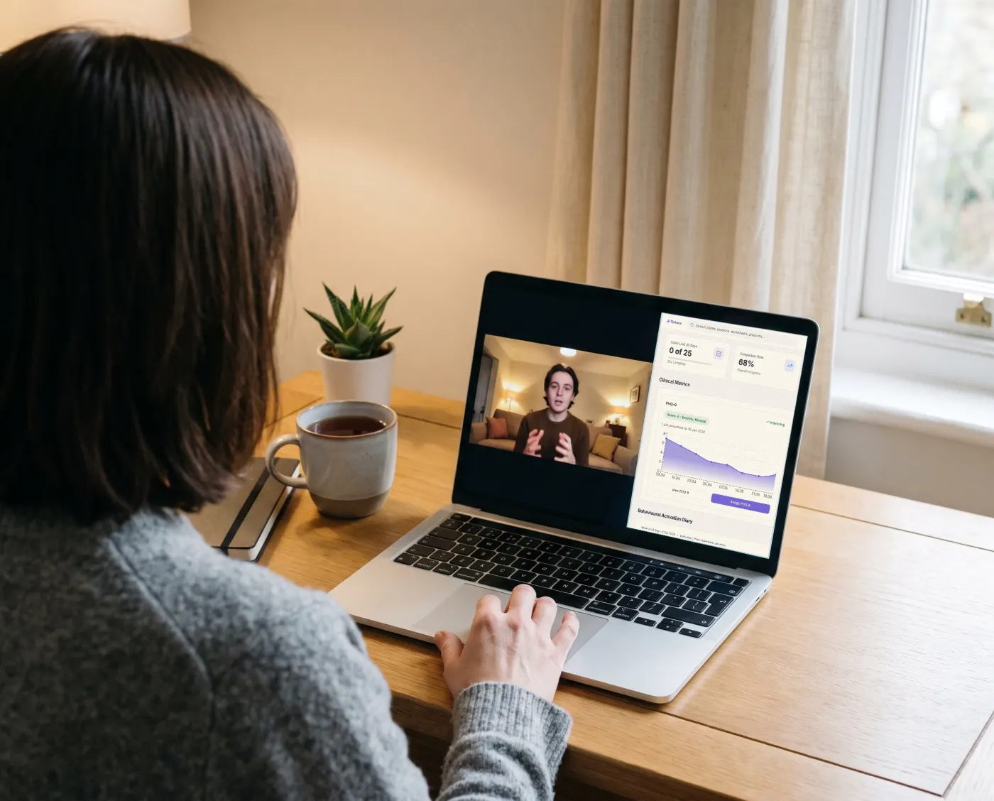 A therapist in an online session, with the client on a video call beside their Flutura progress view.